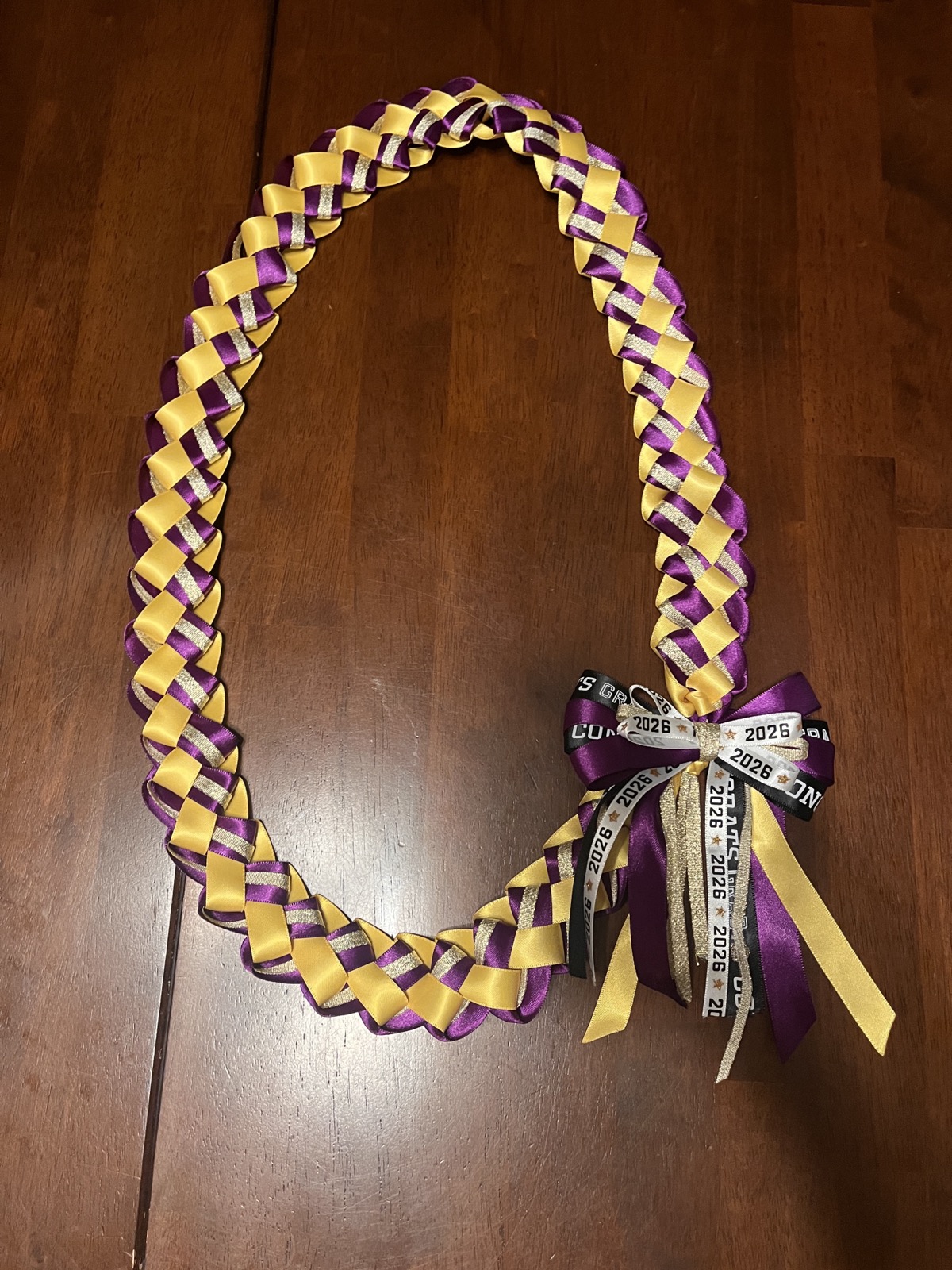 Purple and gold braided ribbon lei